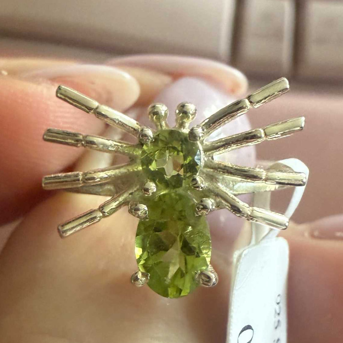 Spider ring with precious metal band and spider legs with gemstone spider body