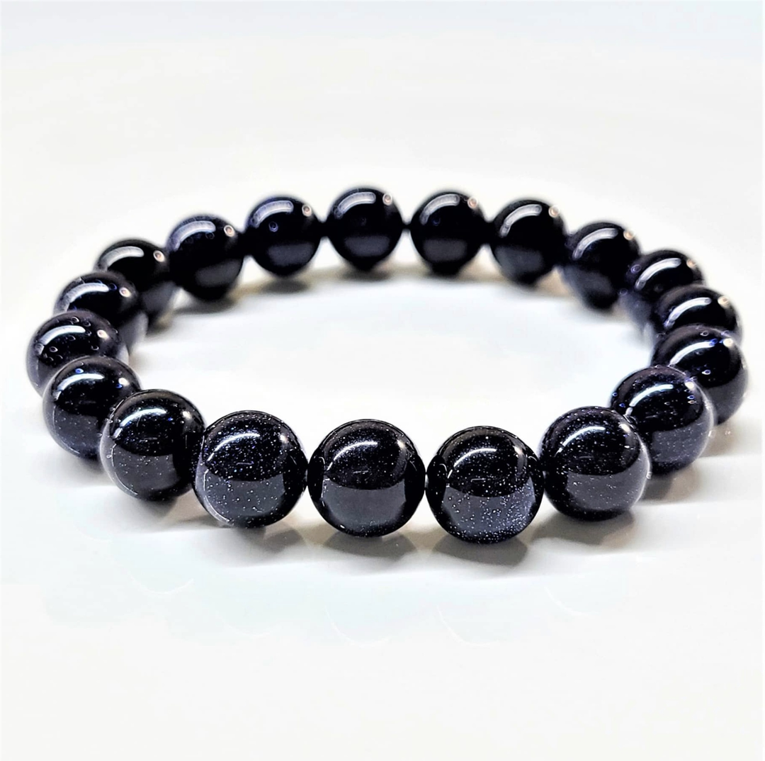 Blue Goldstone stackable bracelet with round polished beads and sparkling finish