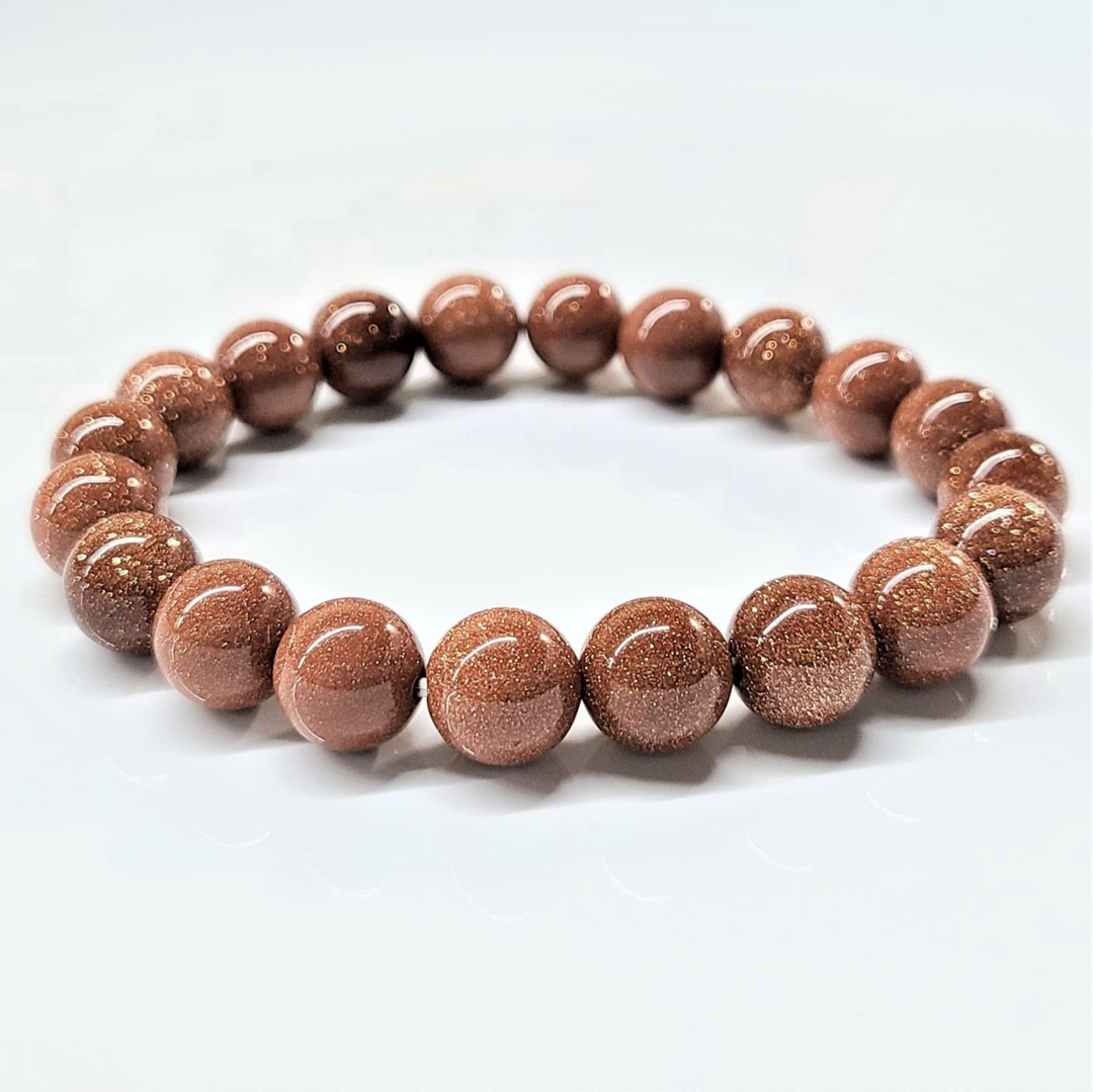 Goldstone round bead stackable bracelet with glittering reddish-brown synthetic gemstone beads