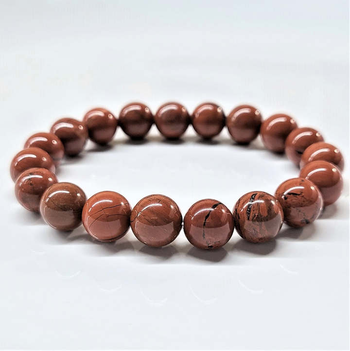 Red Jasper round bead stackable bracelet with polished deep red stones for grounding and vitality