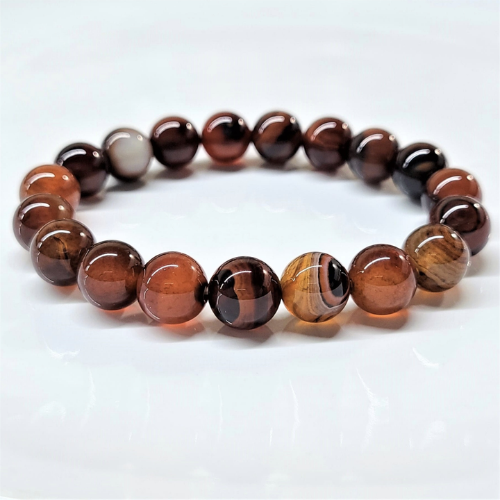 Red Agate stackable round bead bracelet promoting stability, confidence, and grounding energy.
