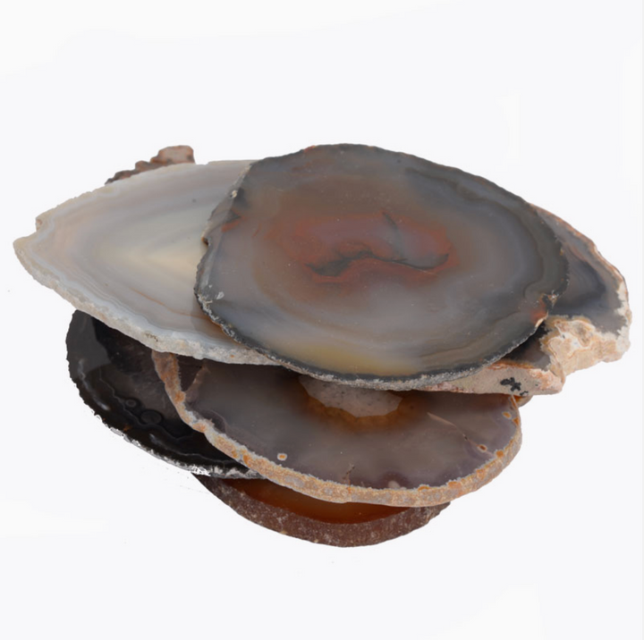 Natural loose agate slices with unique patterns and earthy tones, 2 to 4 inches each, displayed in a stacked arrangement.