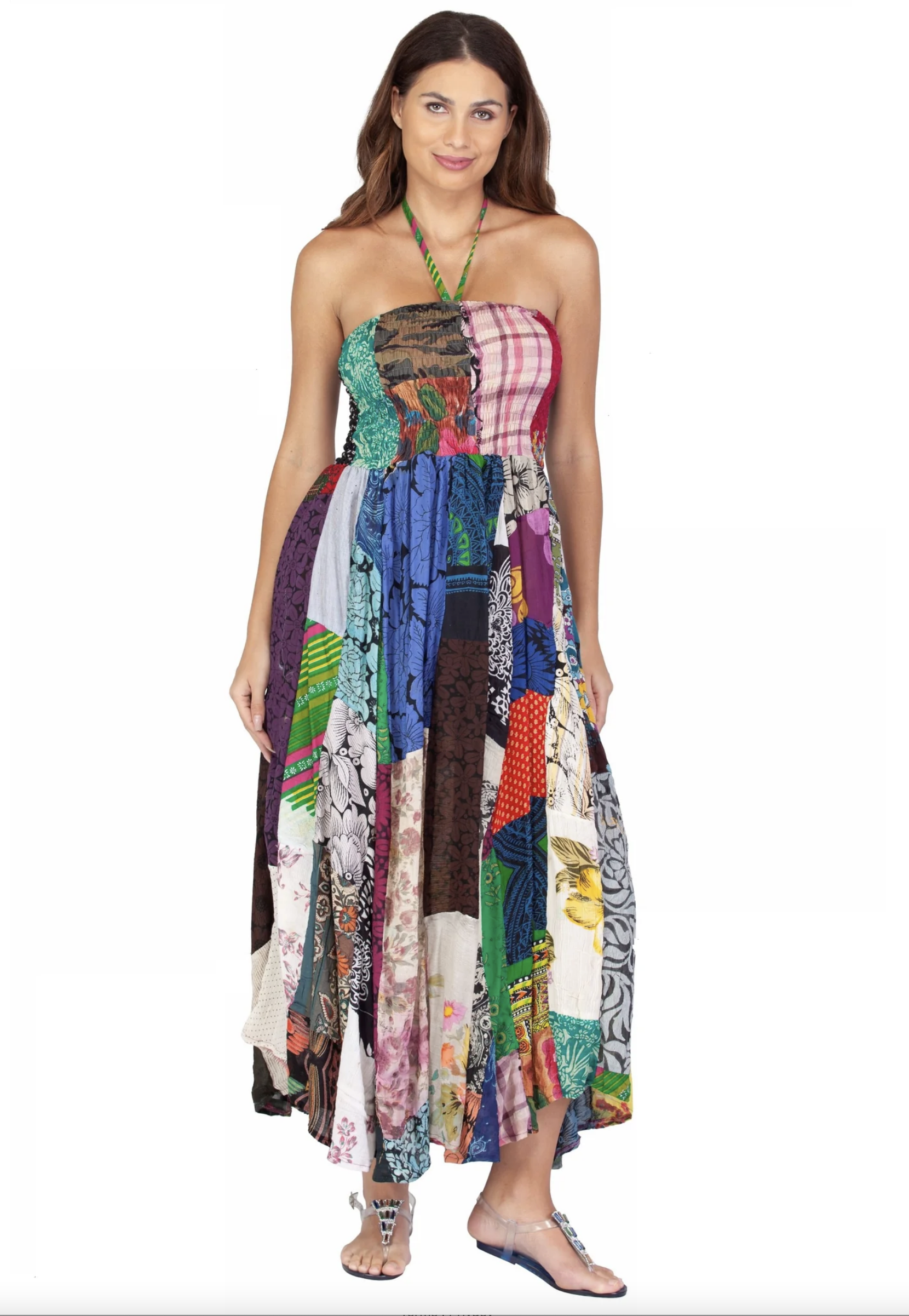 Woman wearing a colorful patchwork tube top handkerchief dress with a halter neck strap and asymmetrical hem