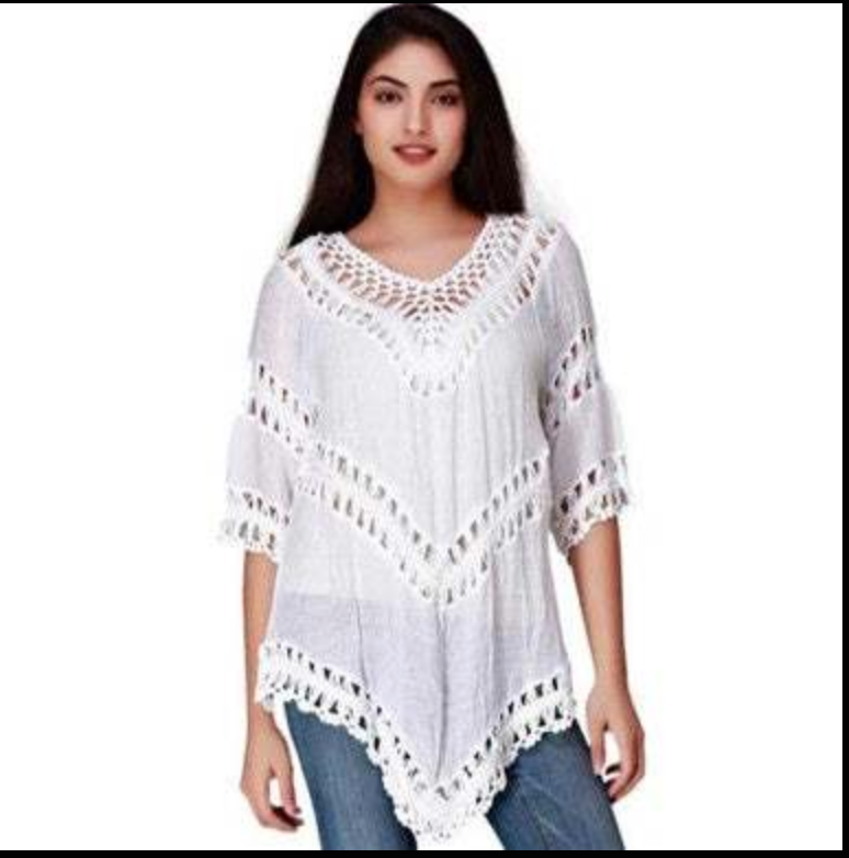 Woman wearing a beautiful white blouse with crocheted sleeves and a V-neck design