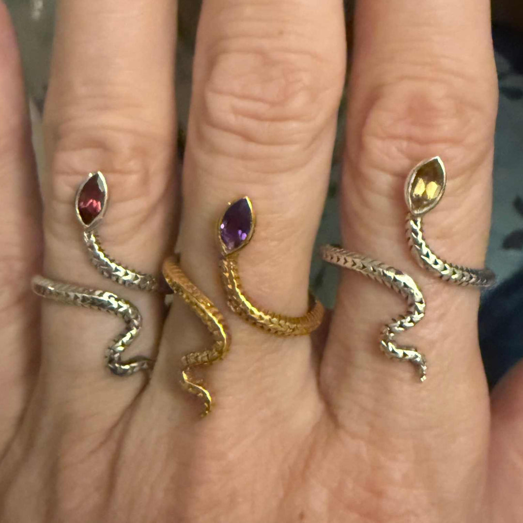 Snake rings with gemstone on hand