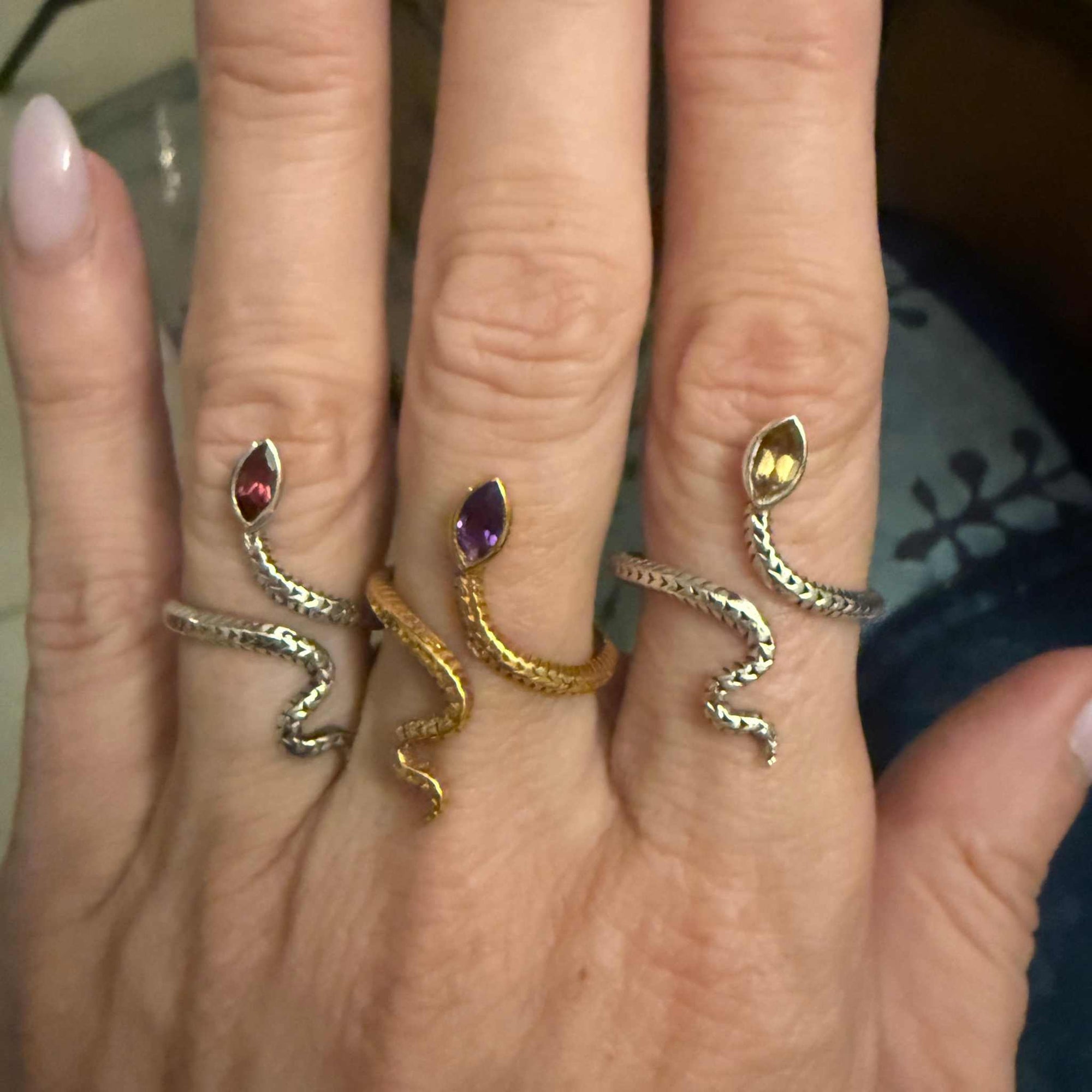 Snake rings with gemstone on hand
