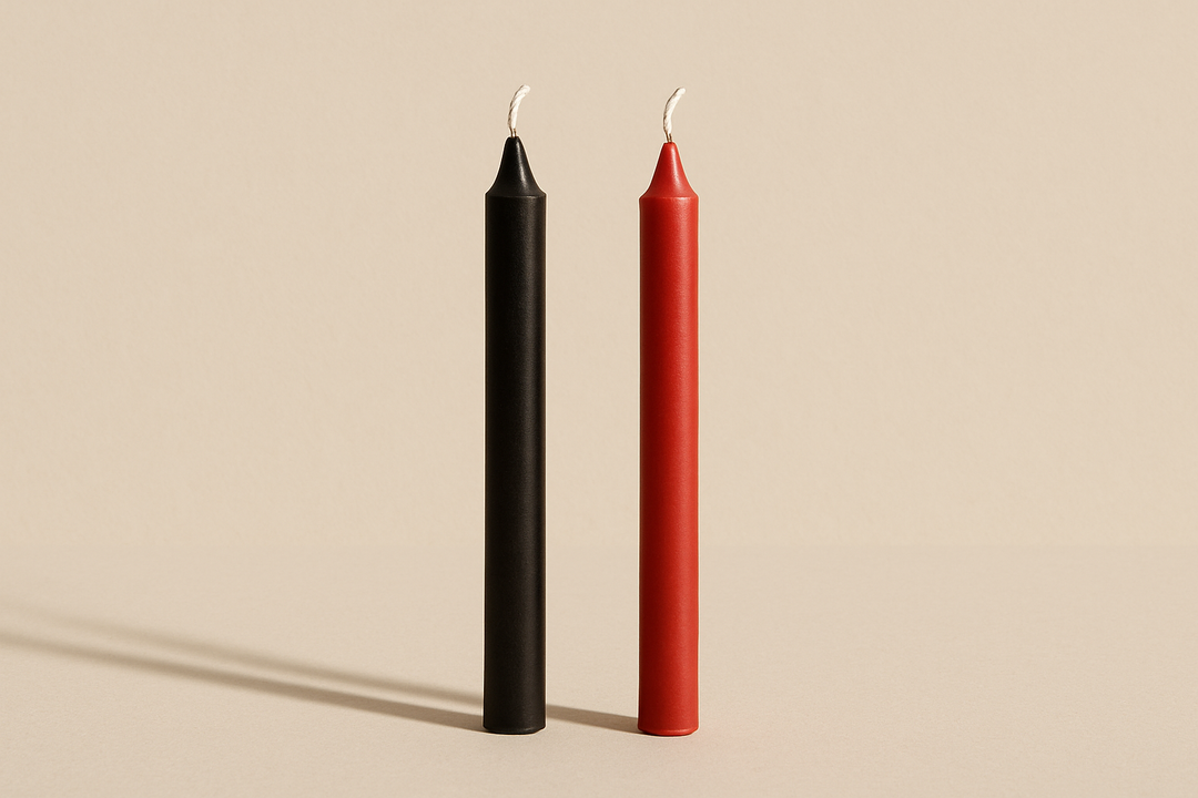 a black and a red chime candleon a nutral background