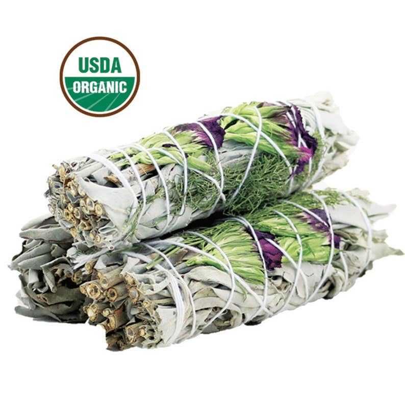 Two 4-inch organic Good Life Floral White Sage smudge sticks with white sage, rosemary, and purple statice flowers, USDA organic label visible.