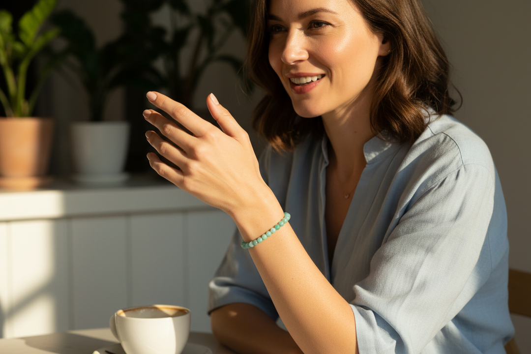 Woman in confident conversation at café wearing teal Amazonite AA bracelet