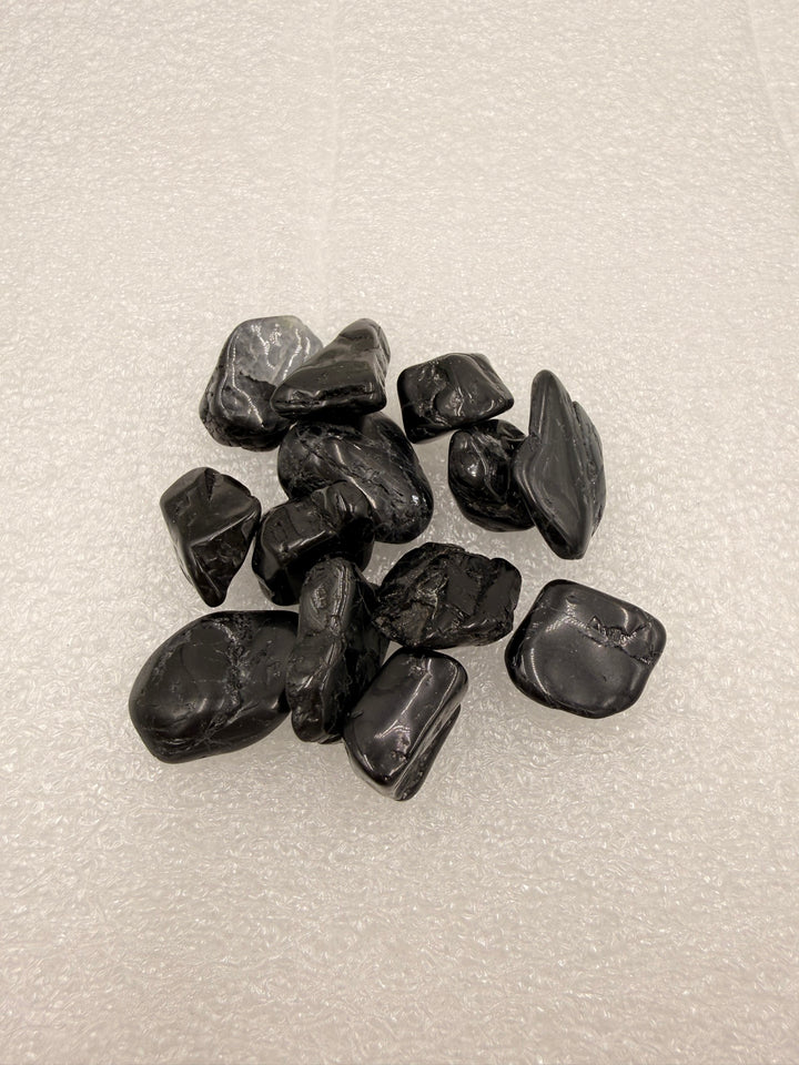 Black tourmaline tumbled pocket stones, group