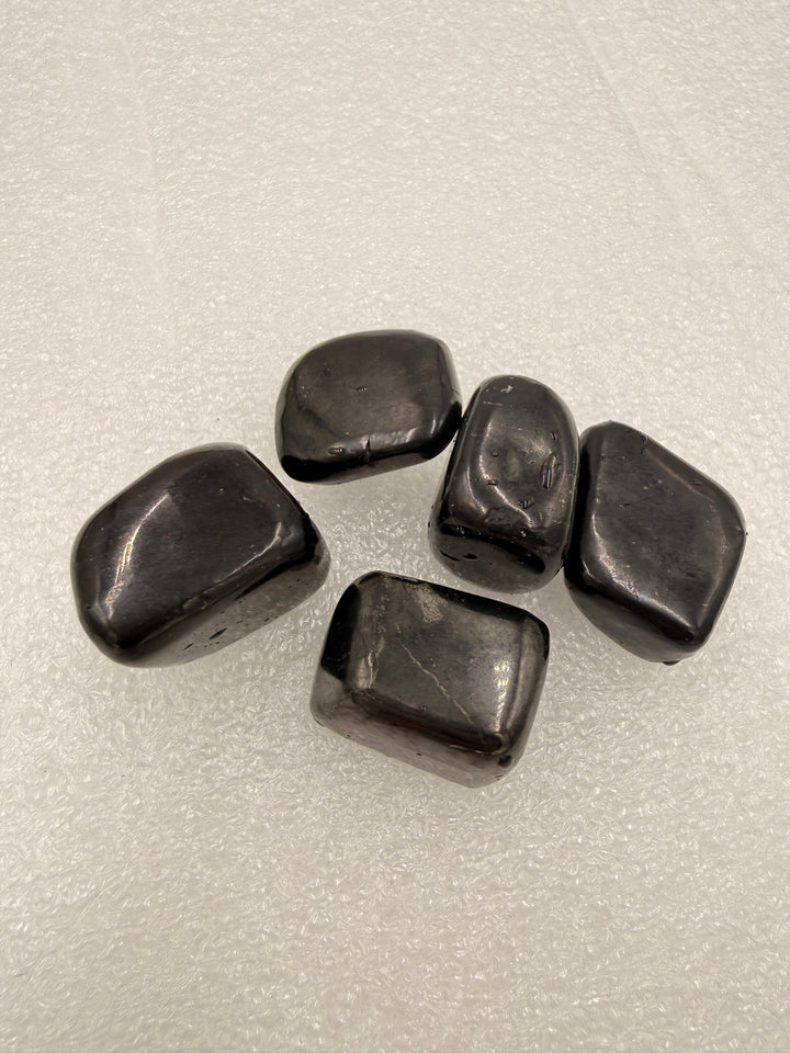 Shungite tumbled stones, group of five