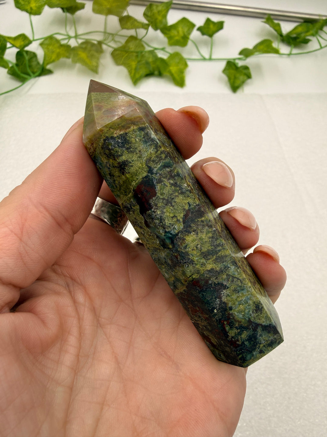Dragon Blood Jasper tower held upright in hand