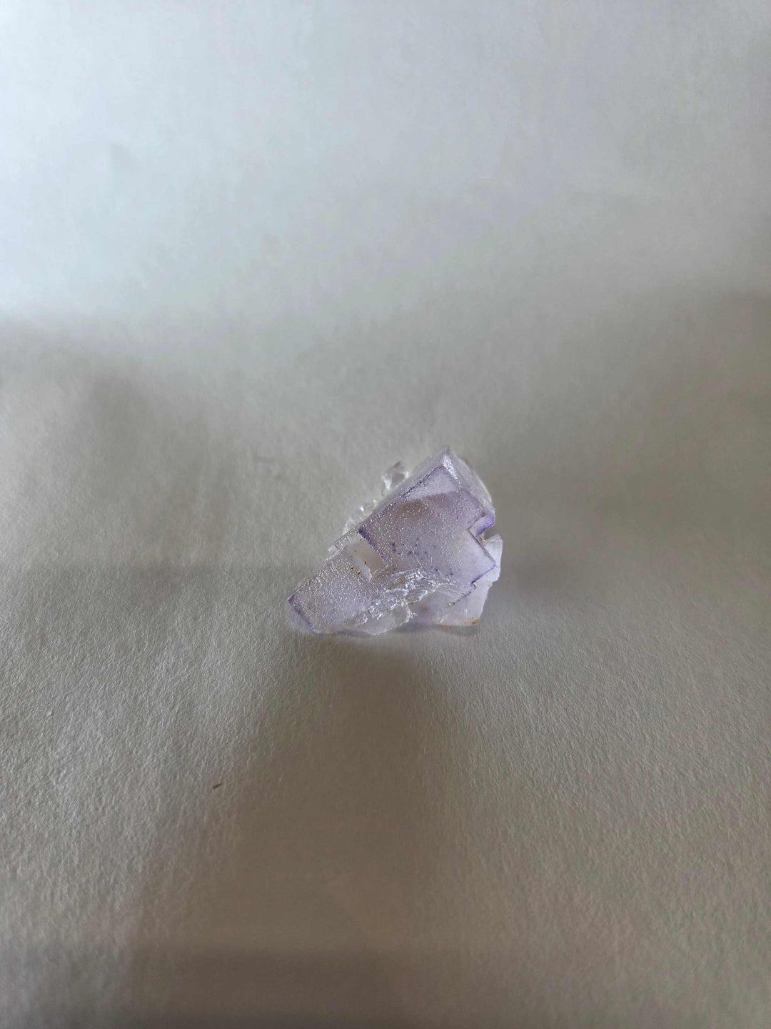 Small purple fluorite specimen known as Prism of Lilac enhancing mental clarity and spiritual awareness