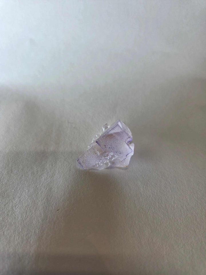 Small purple fluorite specimen known as Prism of Lilac enhancing mental clarity and spiritual awareness