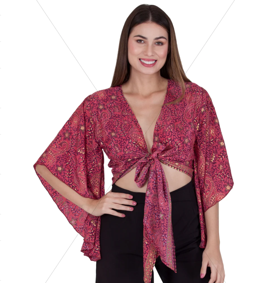 Woman wearing pink Sari tie front blouse with gold patterns and wide sleeves made of 100% polyester